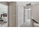 Hallway featuring large closet with views of main bedroom at 404 Ascott Way, Durham, NC 27713