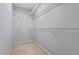 Walk-in closet with carpeted floors and white wire shelving on all sides, maximizing the storage potential of the space at 404 Ascott Way, Durham, NC 27713