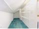 Spacious attic featuring built-in shelving and clean carpeting, ideal for storage or customization at 404 Sw Maynard Rd, Cary, NC 27511