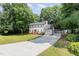 Exterior view of two-story home featuring a driveway, garage and a well-maintained front lawn with landscaping at 404 Sw Maynard Rd, Cary, NC 27511