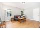 Cozy living room with hardwood floors, natural light, and comfortable seating at 404 Sw Maynard Rd, Cary, NC 27511