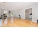 Bright living room with hardwood floors, large windows, and a neutral color palette at 404 Sw Maynard Rd, Cary, NC 27511