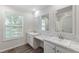 Bathroom featuring dual sinks, a window, and a view of the shower at 41 Andrea Ct, Sanford, NC 27332