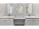 Bathroom featuring dual sinks, a window, and a vanity area with a marble countertop at 41 Andrea Ct, Sanford, NC 27332