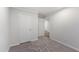 Spacious bedroom with neutral paint and carpet, and a hallway leading to other rooms at 41 Andrea Ct, Sanford, NC 27332