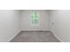 Bright bedroom featuring gray carpet and a window allowing for ample natural light at 41 Andrea Ct, Sanford, NC 27332