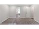 Bright and airy bedroom with neutral carpet and paint leading to other rooms at 41 Andrea Ct, Sanford, NC 27332