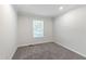 Cozy bedroom featuring neutral paint and carpet, and a bright window at 41 Andrea Ct, Sanford, NC 27332