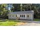 Charming single-story home with a well-manicured lawn and a gravel driveway at 41 Andrea Ct, Sanford, NC 27332