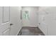 Spacious laundry room with a back door, a window, and a wire shelf at 41 Andrea Ct, Sanford, NC 27332