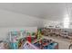 Spacious attic filled with toys and doll collection providing ample room for recreational activities and storage at 412 Coggeshall St, Oxford, NC 27565