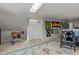 Cozy attic space decorated with art and comfortable seating; perfect for relaxation or hobby space at 412 Coggeshall St, Oxford, NC 27565