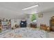 Cozy attic room with a comfy chair, a window, books, and quirky decorations at 412 Coggeshall St, Oxford, NC 27565