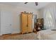Charming bedroom with hardwood floors, armoire, and decorative accents creating a cozy, inviting atmosphere at 412 Coggeshall St, Oxford, NC 27565