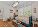 Bedroom featuring daybed, area rug, and chandelier creating a relaxing and stylish retreat at 412 Coggeshall St, Oxford, NC 27565