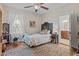 Bedroom with hardwood floors, large window, and a bathroom en suite at 412 Coggeshall St, Oxford, NC 27565