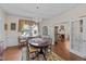 Charming dining room with hardwood floors, chandelier, and views to the living room at 412 Coggeshall St, Oxford, NC 27565