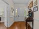 A traditional foyer with hardwood floors, decorative molding, and a vintage writing desk at 412 Coggeshall St, Oxford, NC 27565