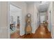 Hallway with hardwood floors, painted trim, and charming antique decor at 412 Coggeshall St, Oxford, NC 27565