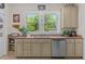 Bright kitchen featuring a double sink with a window offering serene views at 412 Coggeshall St, Oxford, NC 27565