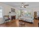 Bright living room with hardwood floors, a decorative fireplace, and ample natural light at 412 Coggeshall St, Oxford, NC 27565