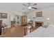 Traditional living room featuring a fireplace, hardwood floors, and a ceiling fan at 412 Coggeshall St, Oxford, NC 27565