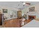 Inviting living room featuring hardwood floors, vintage furniture, and a cozy fireplace at 412 Coggeshall St, Oxford, NC 27565