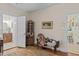 Sitting room with hardwood floors, decorative furnishings, and doorway to the bathroom at 412 Coggeshall St, Oxford, NC 27565