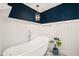 Bathroom highlighting a freestanding tub, gold light fixture, and unique tiling at 4151 Deep Wood Cir, Durham, NC 27707