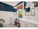 Bathroom showcasing double vanities, modern fixtures, and a bright window view at 4151 Deep Wood Cir, Durham, NC 27707