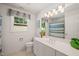 Clean bathroom featuring a white vanity, a large mirror, and a shower with curtain at 4151 Deep Wood Cir, Durham, NC 27707