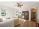Bright bedroom boasts wood floors, ceiling fan, natural light, and neutral walls at 4151 Deep Wood Cir, Durham, NC 27707