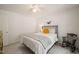 Inviting bedroom features carpeted floors, metal-framed bed, and a charming rocking chair at 4151 Deep Wood Cir, Durham, NC 27707