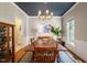 Dining room showcasing blue ceiling, modern lighting, and views of a large backyard at 4151 Deep Wood Cir, Durham, NC 27707