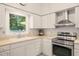 Bright kitchen with stainless steel appliances and a window providing natural light at 4151 Deep Wood Cir, Durham, NC 27707