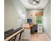 Bright office space with natural light, neutral paint, and complete with desk and keyboard at 4151 Deep Wood Cir, Durham, NC 27707