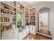 Well-organized pantry with custom built-ins, offering ample storage space and natural light at 4151 Deep Wood Cir, Durham, NC 27707