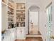 Charming pantry with custom shelves and storage, leading to the study at 4151 Deep Wood Cir, Durham, NC 27707