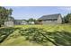Large, fenced backyard featuring a shed and a well-maintained lawn, perfect for recreation at 465 Gianna Dr, Clayton, NC 27527