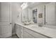 Bright bathroom with double vanity, modern fixtures, and a large mirror at 465 Gianna Dr, Clayton, NC 27527