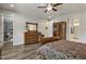 Bedroom features a bed, wood look floors, access to a bathroom and large dresser at 465 Gianna Dr, Clayton, NC 27527