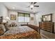 Comfortable bedroom with detailed bed frame, wood-look floors, and classic furniture at 465 Gianna Dr, Clayton, NC 27527