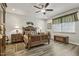 Bedroom with wood-look floors, decorative ceiling fan, and classic furniture at 465 Gianna Dr, Clayton, NC 27527
