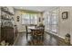 Cozy breakfast nook with wood floors, window treatments, and a nearby patio door at 465 Gianna Dr, Clayton, NC 27527