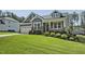 Beautiful two-story home with manicured lawn and inviting front porch at 465 Gianna Dr, Clayton, NC 27527