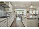 Gourmet kitchen with granite countertops, stainless appliances, and a view to the dining area at 465 Gianna Dr, Clayton, NC 27527