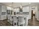A modern kitchen with stainless steel appliances, center island and pendant lighting at 465 Gianna Dr, Clayton, NC 27527