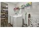 Laundry room with a front load washer and dryer set and lots of storage space at 465 Gianna Dr, Clayton, NC 27527