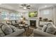 Cozy living room featuring a fireplace, plush seating, and natural light at 465 Gianna Dr, Clayton, NC 27527