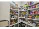 Walk-in pantry with shelves stocked with food items and household goods at 465 Gianna Dr, Clayton, NC 27527
